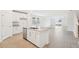 Modern kitchen with white cabinets, granite countertops, and stainless steel appliances at 2137 Rosewood Dr, Bartow, FL 33830