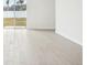 Bright living room with tile floors and backyard access at 2137 Rosewood Dr, Bartow, FL 33830