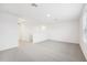 Bright and airy loft with grey carpeting and access to a hallway at 2137 Rosewood Dr, Bartow, FL 33830