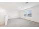 Spacious loft area with carpet flooring and two windows at 2137 Rosewood Dr, Bartow, FL 33830