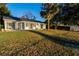 Large backyard with grassy area and home view at 1704 Ison Ln, Ocoee, FL 34761