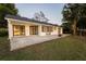 Spacious backyard with fire pit and lake view at 1704 Ison Ln, Ocoee, FL 34761