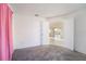 Bedroom with doors opening to a bright living area at 1704 Ison Ln, Ocoee, FL 34761