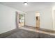 Spacious bedroom with patio access and bathroom view at 1704 Ison Ln, Ocoee, FL 34761