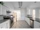 Updated kitchen featuring granite countertops, stainless steel appliances, and a breakfast bar at 1704 Ison Ln, Ocoee, FL 34761