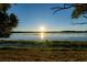 Scenic sunset view over calm lake waters at 1704 Ison Ln, Ocoee, FL 34761