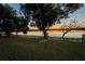 Serene lakefront yard with sunset view at 1704 Ison Ln, Ocoee, FL 34761