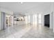 Bright and spacious living area with tile floors and access to the kitchen and patio at 1704 Ison Ln, Ocoee, FL 34761
