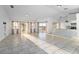 Sun-drenched living room with access to a lake view patio and an open kitchen at 1704 Ison Ln, Ocoee, FL 34761