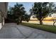 Patio with fire pit and lake view at sunset at 1704 Ison Ln, Ocoee, FL 34761