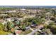 An aerial view of the neighborhood showcases the houses surrounded by mature trees and manicured lawns at 4317 Ne 12Th St, Ocala, FL 34470