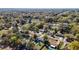 Aerial view of homes surrounded by mature trees, single-Gathering homes and in-ground swimming pools at 4317 Ne 12Th St, Ocala, FL 34470