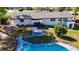 Aerial view of a single-story home with in-ground pool and partially shaded backyard at 4317 Ne 12Th St, Ocala, FL 34470