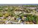 Aerial view of the neighborhood featuring mature trees, single-Gathering homes and in-ground swimming pools at 4317 Ne 12Th St, Ocala, FL 34470