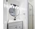 This bathroom features a single vanity, a tiled shower, and bright lighting at 4317 Ne 12Th St, Ocala, FL 34470