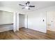 Bright bedroom with new floors, closet, a ceiling fan, and fresh white paint at 4317 Ne 12Th St, Ocala, FL 34470