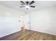 Bright bedroom featuring hardwood flooring, ceiling fan, and neutral paint at 4317 Ne 12Th St, Ocala, FL 34470