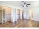 This bedroom has wood-look floors, bright natural light, and large closet space at 4317 Ne 12Th St, Ocala, FL 34470