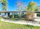Charming single-story home with neatly trimmed landscaping and walkway at 4317 Ne 12Th St, Ocala, FL 34470