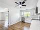Well-lit kitchen with white cabinets and stainless steel dishwasher, offering a clean aesthetic at 4317 Ne 12Th St, Ocala, FL 34470
