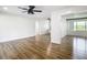 Spacious living room with wood flooring, ceiling fan, and great natural light at 4317 Ne 12Th St, Ocala, FL 34470