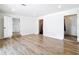 View of the living room showcasing doorways leading to the kitchen and what could be bedrooms at 4317 Ne 12Th St, Ocala, FL 34470