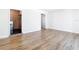 Spacious living room with new floors and multiple doorways to other rooms at 4317 Ne 12Th St, Ocala, FL 34470