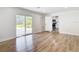 Living room with sliding doors leading outside and an open door into the kitchen at 4317 Ne 12Th St, Ocala, FL 34470
