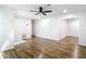 Open concept living room with ceiling fan, wooden floors, and plenty of natural light at 4317 Ne 12Th St, Ocala, FL 34470