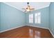 Bright, well-lit bedroom with hardwood floors, two windows with white shutters, and a ceiling fan at 5342 Horton Ln, Orlando, FL 32814