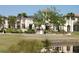 Community clubhouse featuring attractive landscaping, water features, and architectural details at 5342 Horton Ln, Orlando, FL 32814