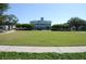 Expansive community green space with manicured lawns and mature trees, ideal for outdoor activities and gatherings at 5342 Horton Ln, Orlando, FL 32814