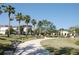 Lush community park with walking path, benches, and mature trees offering shade at 5342 Horton Ln, Orlando, FL 32814