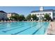 Community pool with lap lanes and deck chairs, set against a backdrop of beautiful building at 5342 Horton Ln, Orlando, FL 32814