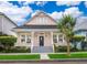 Charming two-story home with a welcoming front porch, manicured yard, and picturesque curb appeal at 5342 Horton Ln, Orlando, FL 32814