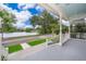 Relaxing front porch view of a serene lake with lush trees and blue sky, offering peaceful outdoor living at 5342 Horton Ln, Orlando, FL 32814