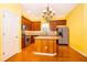 Well-equipped kitchen featuring an island, stainless steel appliances, granite countertops, and ample cabinet space at 5342 Horton Ln, Orlando, FL 32814