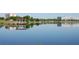Scenic lake view with a wooden pier and gazebo, perfect for relaxing and enjoying the water at 5342 Horton Ln, Orlando, FL 32814