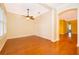 Spacious living room with hardwood floors, ceiling fan, and open layout, perfect for entertaining and relaxation at 5342 Horton Ln, Orlando, FL 32814