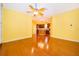 Spacious living room with hardwood floors and open layout to the kitchen, ideal for entertaining guests at 5342 Horton Ln, Orlando, FL 32814