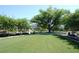 Well-manicured park with sprawling lawns, mature trees, and park benches, creating an inviting outdoor space at 5342 Horton Ln, Orlando, FL 32814