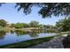 Picturesque pond with a charming bridge, landscaped surroundings, and walking paths, offering a tranquil setting at 5342 Horton Ln, Orlando, FL 32814