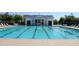 Large community swimming pool with lap lanes and lounge chairs, perfect for exercise and relaxation at 5342 Horton Ln, Orlando, FL 32814