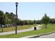 Scenic walking path lined with lush trees and foliage, inviting residents to enjoy nature and recreation at 5342 Horton Ln, Orlando, FL 32814