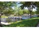 Picturesque community water feature with small waterfalls and lush landscaping, enhancing the serene ambiance at 5342 Horton Ln, Orlando, FL 32814