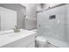 Clean bathroom features a white vanity, a glass-enclosed shower, and modern fixtures at 571 Masalo Pl, Lake Mary, FL 32746