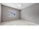 Neutral bedroom with light gray walls, ceiling fan and tile floors at 571 Masalo Pl, Lake Mary, FL 32746