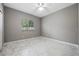 Minimal bedroom featuring tile flooring, a window, and closet at 571 Masalo Pl, Lake Mary, FL 32746