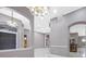 Open living area featuring modern lighting, columns, and views into other rooms at 571 Masalo Pl, Lake Mary, FL 32746