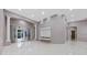 Spacious living area with tile flooring, modern fixtures, and access to outdoor space at 571 Masalo Pl, Lake Mary, FL 32746